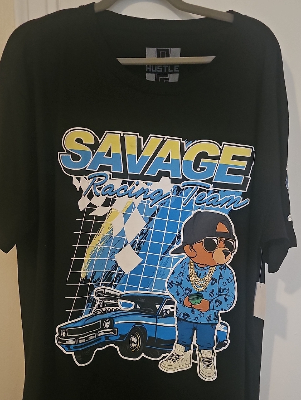 Hustler Hollywood Black Tee with Blue and Yellow Savage Racing Graphic